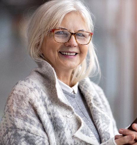 Senior man in sweater smiling with All-on-4 in Dumfries, VA