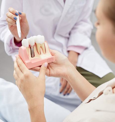 Dumfries implant dentist describing dental implants to patient 
