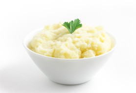 owl of mashed potatoes with small garnish on top