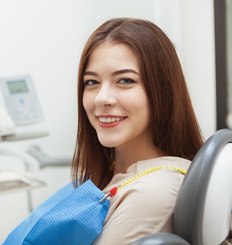 Female patient smiling after receiving dental implants in Dumfries, VA