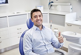 Man giving thumbs up after receiving dental implants in Dumfries, VA