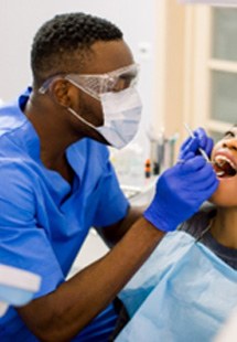 Woodbridge oral surgeon examining patient's teeth
