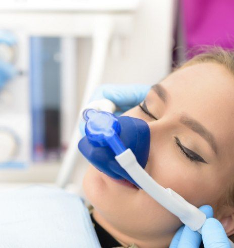 Patient receiving treatment under nitrous oxide dental sedation