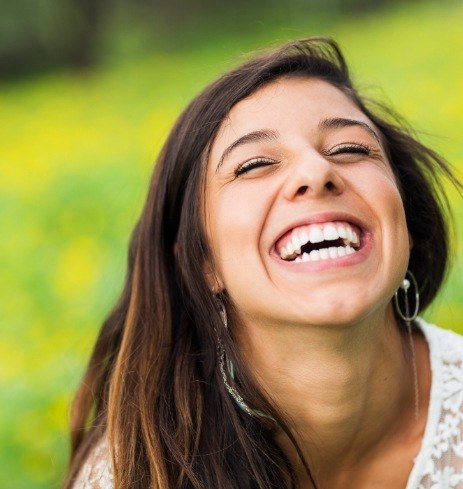 Woman smiling after facial trauma repair