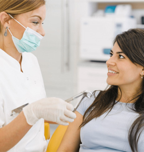 A patient during her wisdom tooth extraction appointment in Dumfries, VA