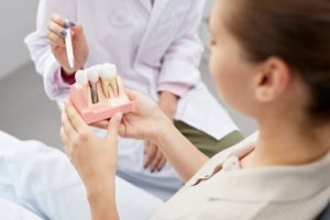 a patient during their dental implant consultation