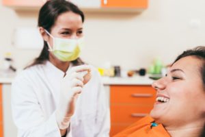 Happy patient smiling after tooth extraction