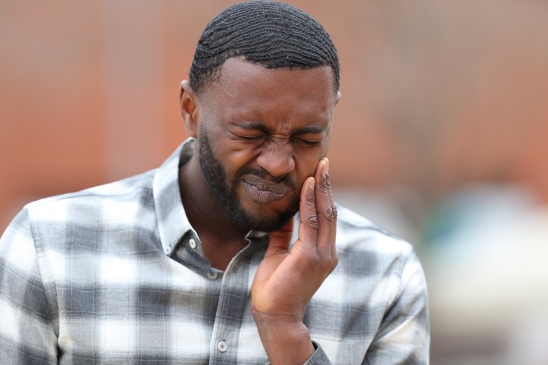 A man in pain due to dry socket