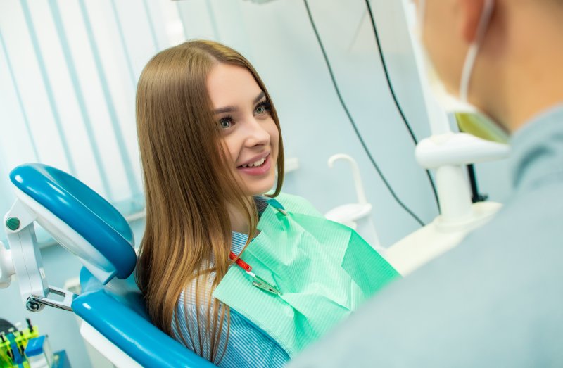 A young woman feeling the effects of sedation dentistry before treatment