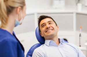 Man asking his oral surgeon questions during his consultation