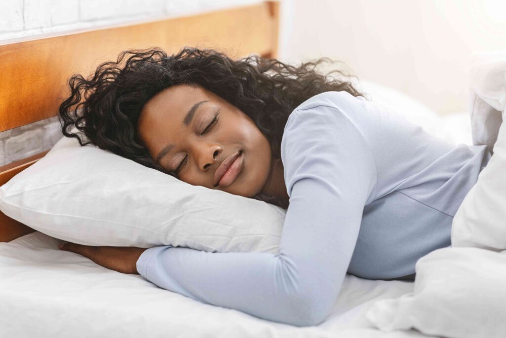 Woman sleeping in a bed